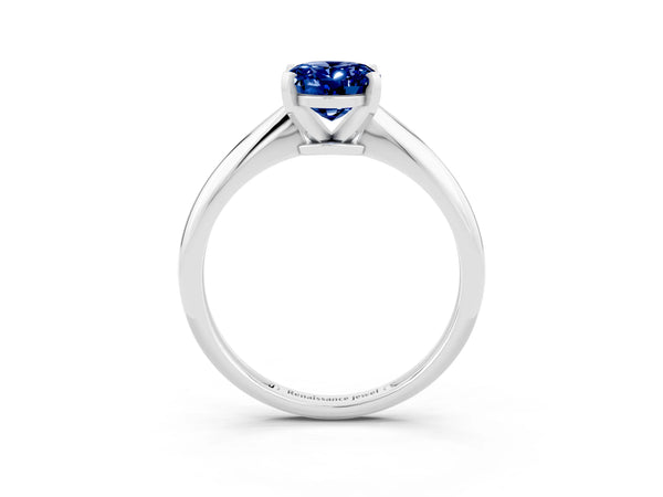 Platinum Oval Cut Blue Sapphire Solitaire Engagement Ring with Classic Band and Four-Prong Setting
