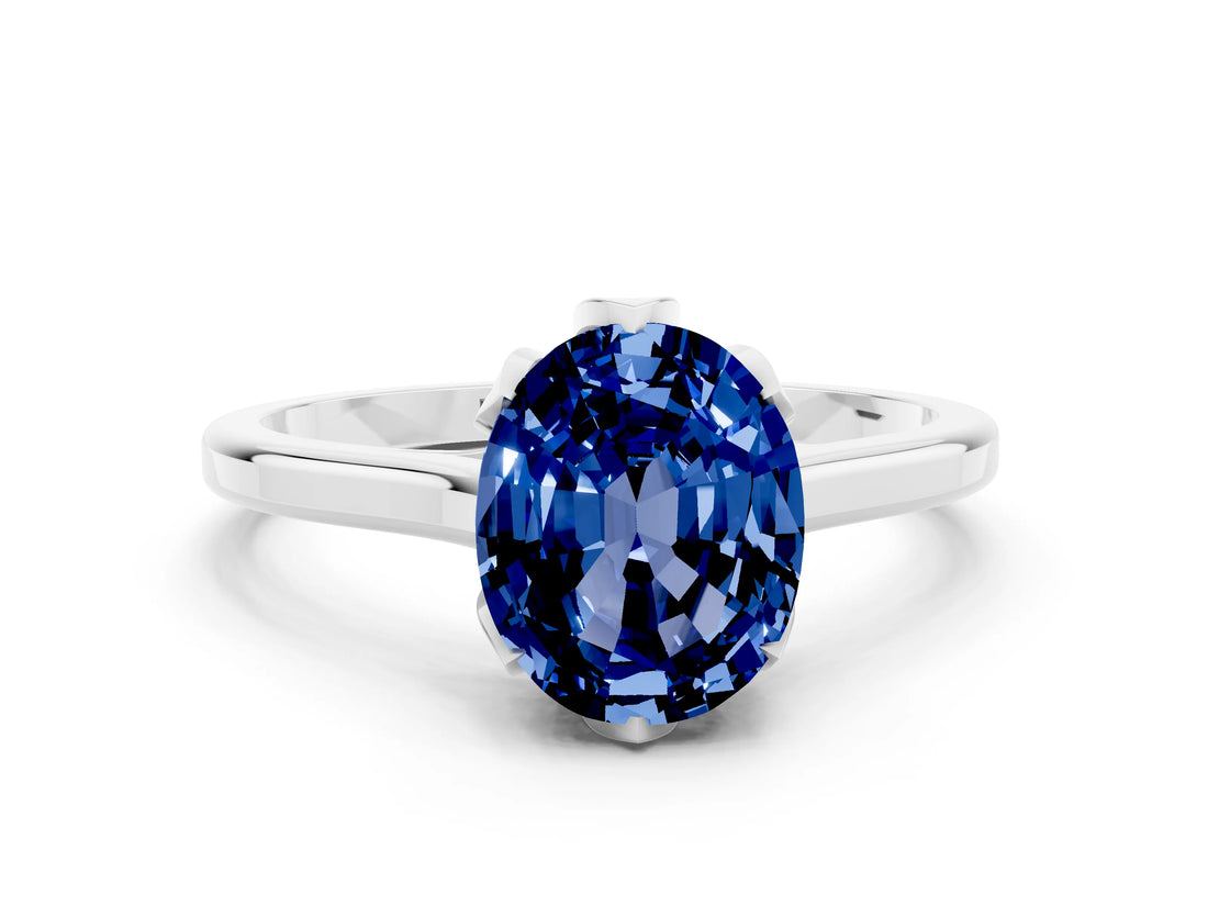 Platinum Oval Cut Blue Sapphire Solitaire Ring with Flower Prong Setting and Classic Band