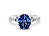 Platinum Oval Cut Blue Sapphire Solitaire Ring with Round  Pavé Band and Four-Prong Setting_36