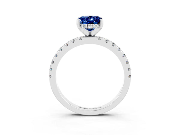 Platinum Oval Cut Blue Sapphire Solitaire Ring with Round Pavé Band and Four-Prong Setting
