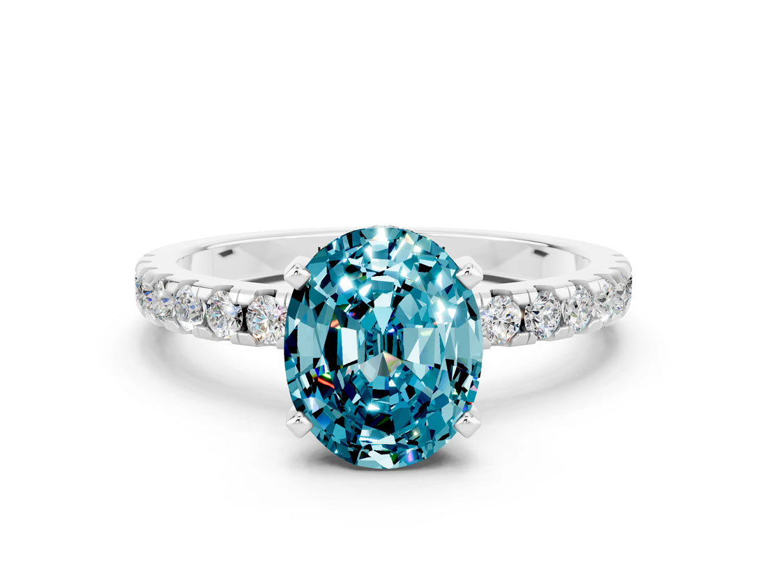 Platinum Oval Cut Blue Topaz Solitaire Ring with Round  Pavé Band and Four-Prong Setting_24