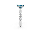 Platinum Oval Cut Blue Topaz Solitaire Ring with Round  Pavé Band and Four-Prong Setting_26