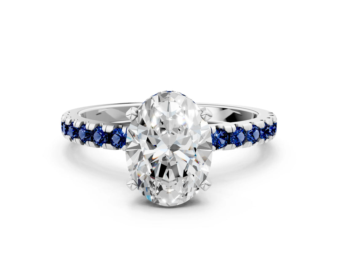Platinum Oval Cut Diamond Solitaire Ring with Round with Blue Sapphire side stone Pavé Band and Four-Prong Setting_12
