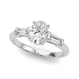 Platinum Oval Cut Diamond Three-Stone Ring with Tapered Baguette Side Stones and Prong Setting