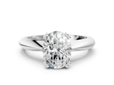Platinum Oval Cut Solitaire Engagement Ring with Tapered Band and Four-Prong Setting