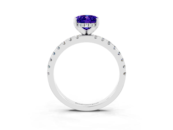 Platinum Oval Cut Tanzanite Solitaire Ring with Round Pavé Band and Four-Prong Setting