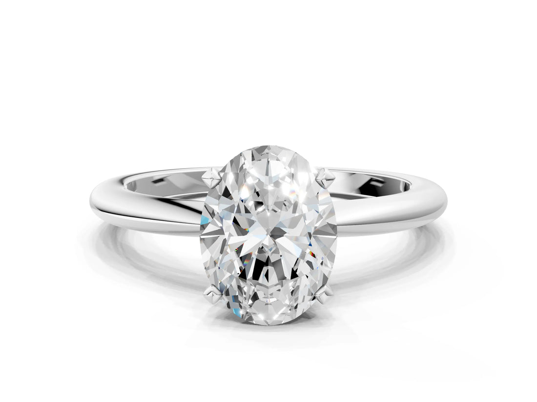 Platinum Oval Solitaire Diamond Ring with Six-Prong Setting on a Classic Band
