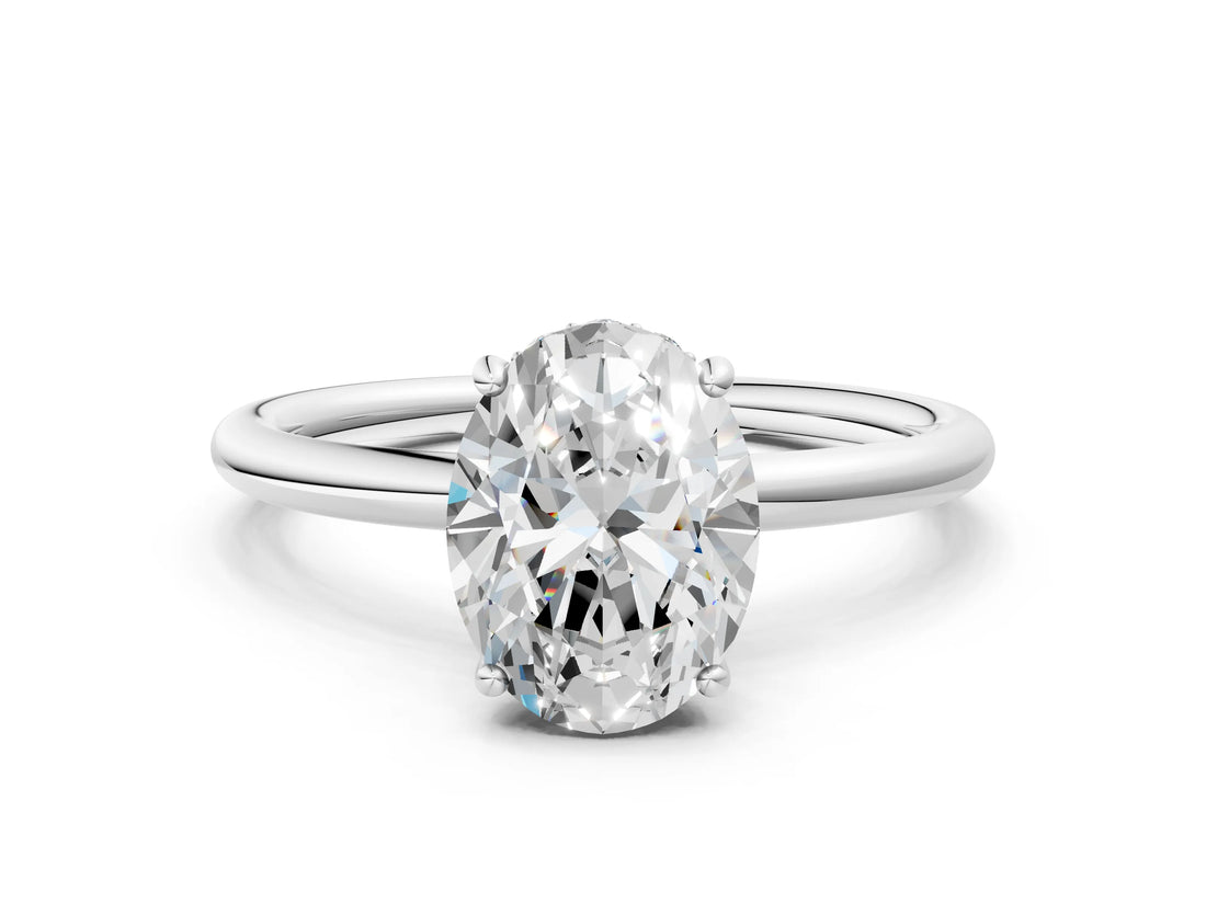 Platinum Oval Solitaire Diamond Ring with a Classic Band and Four-Prong Setting 1