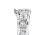 Platinum Pear Brilliant Solitaire with Side Stones on a Pave Band and Four-Prong Setting_39