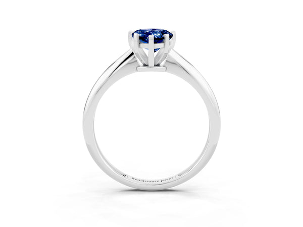 Platinum Pear Cut Blue Sapphire Solitaire Engagement Ring with Classic Band and Four-Prong Setting