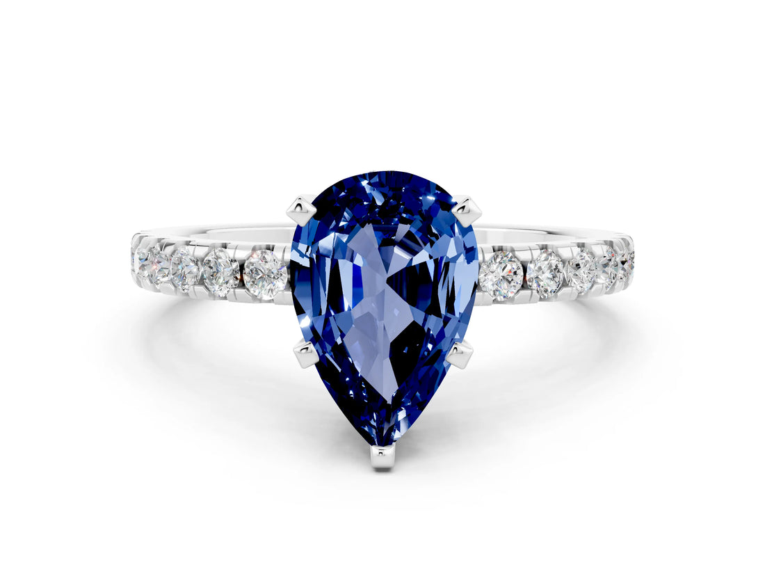 Platinum Pear Cut Blue Sapphire Solitaire Ring with Round  Pavé Band and Four-Prong Setting_36