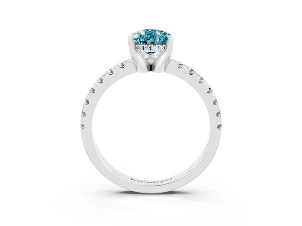 Platinum Pear Cut Blue Topaz Solitaire Ring with Round Pavé Band and Four-Prong Setting