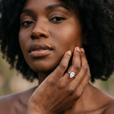 Platinum Pear Cut Diamond Solitaire Ring with Flower Prong Setting and Classic Band