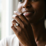 Platinum Pear Cut Diamond Solitaire Ring with Flower Prong Setting and Classic Band