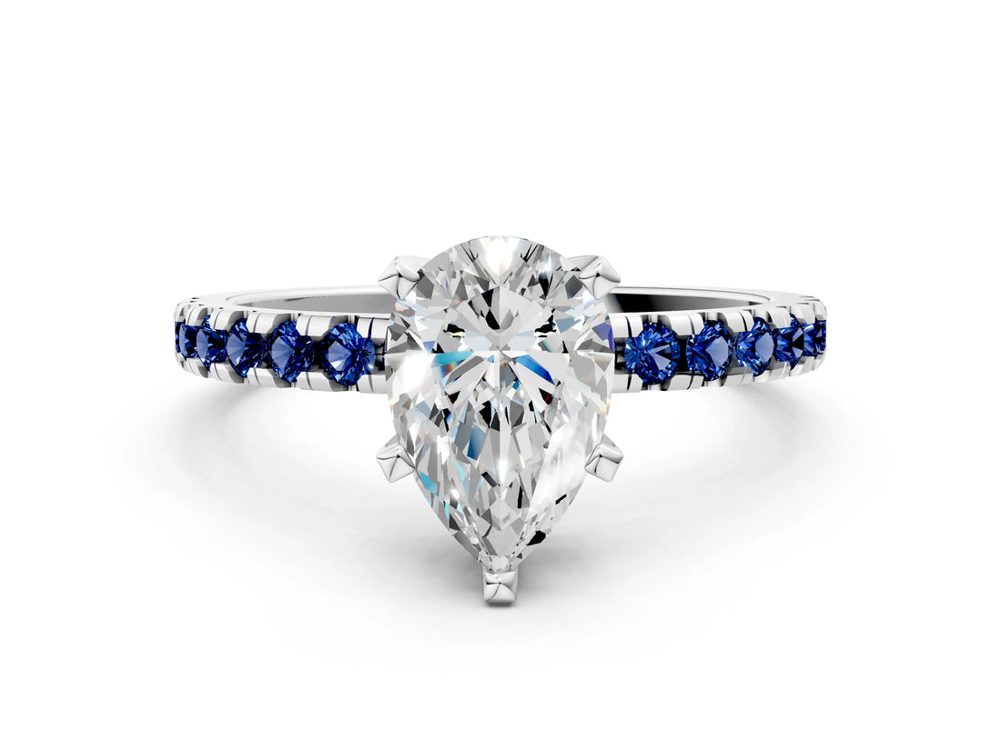 Platinum Pear Cut Diamond Solitaire Ring with Round with Blue Sapphire side stone Pavé Band and Four-Prong Setting_12