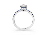Platinum Pear Cut Diamond Solitaire Ring with Round with Blue Sapphire side stone Pavé Band and Four-Prong Setting_15