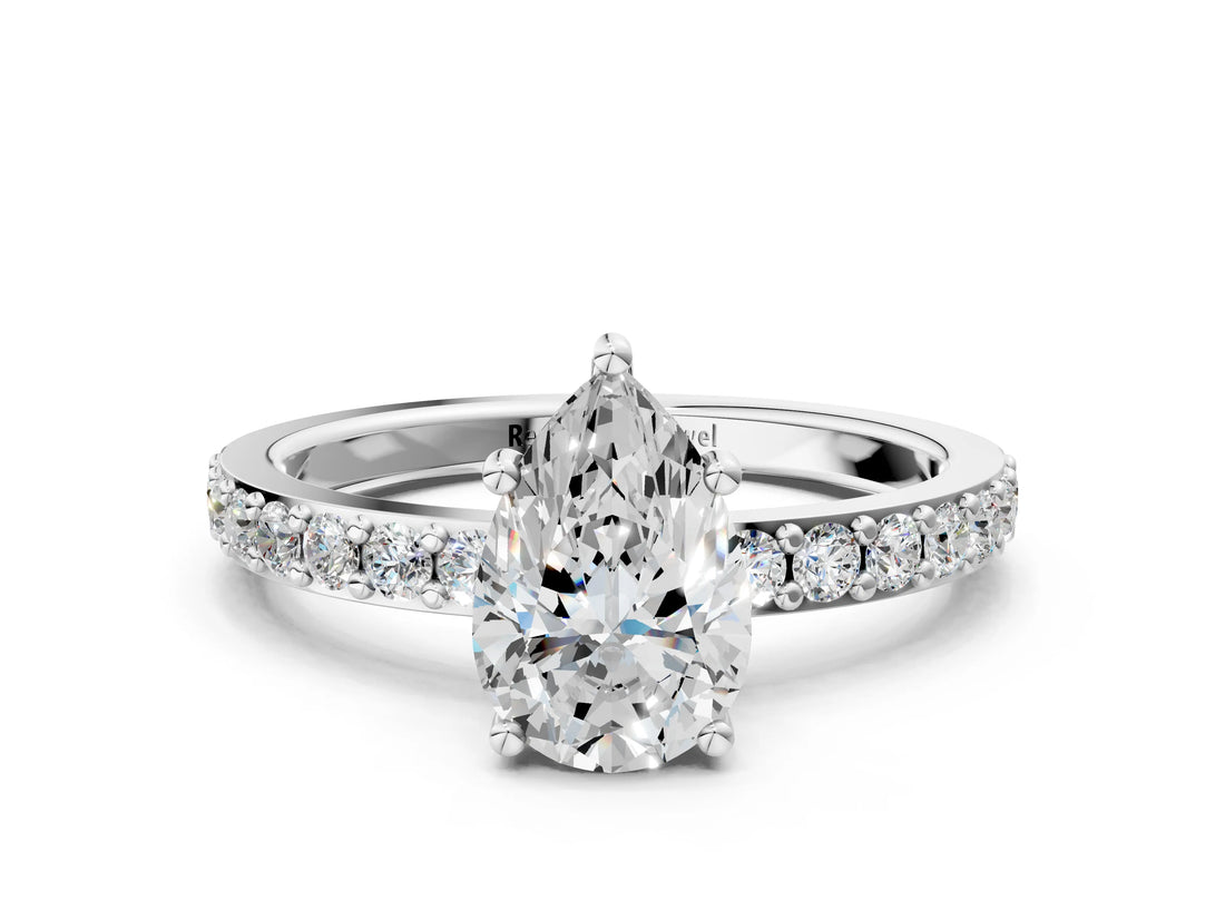 Platinum Pear Cut Diamond Solitaire with Pave Band and Four-Prong Setting