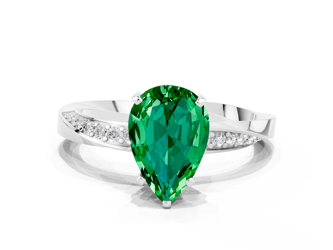 Platinum Pear Cut Emerald Engagement Ring with Side Stone Accents and Four-Prong Setting_12