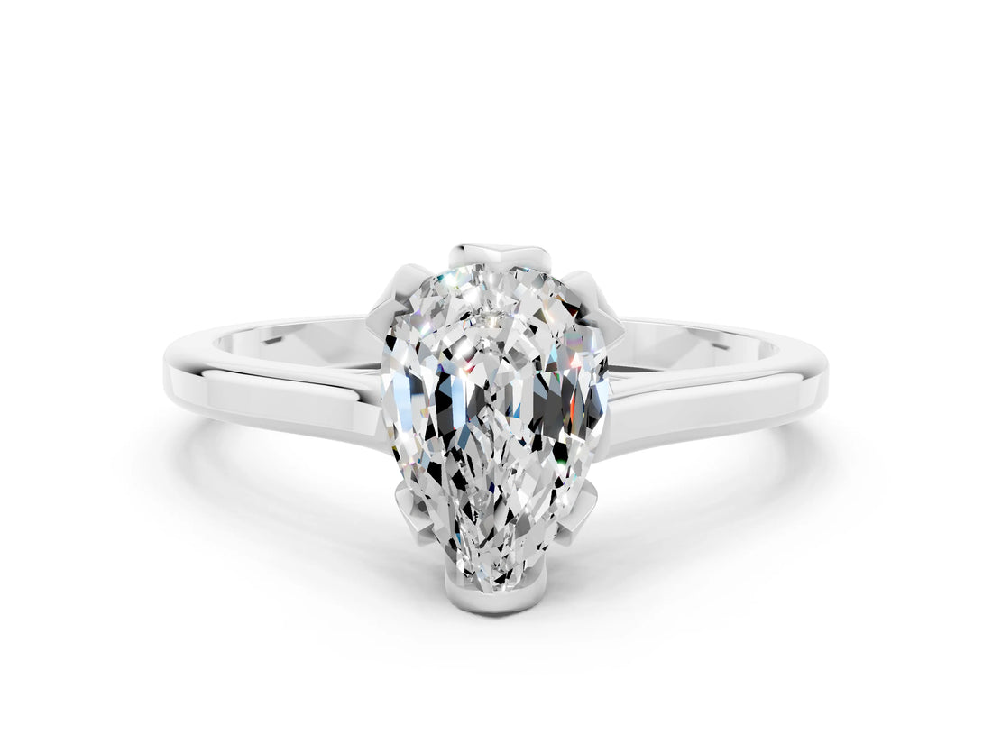 Platinum Pear Cut Moissanite Solitaire Ring with Flower Prong Setting and Classic Band