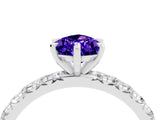 Platinum Pear Cut Tanzanite Pavé Solitaire Ring with Round Band and Prong Setting_46