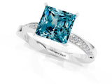 Platinum Princess Cut Blue Topaz Engagement Ring with Side Stone Accents and Four-Prong Setting_25