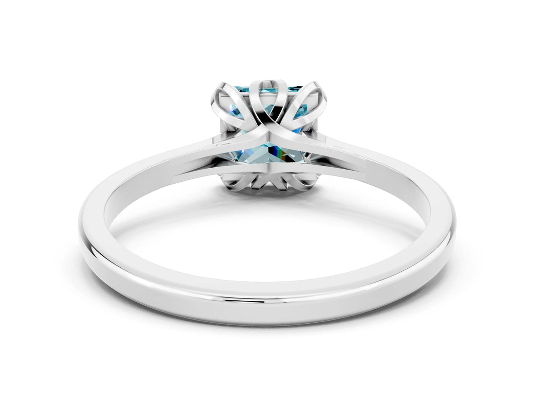 Platinum Princess Cut Blue Topaz Solitaire Ring with Flower Prong Setting and Classic Band