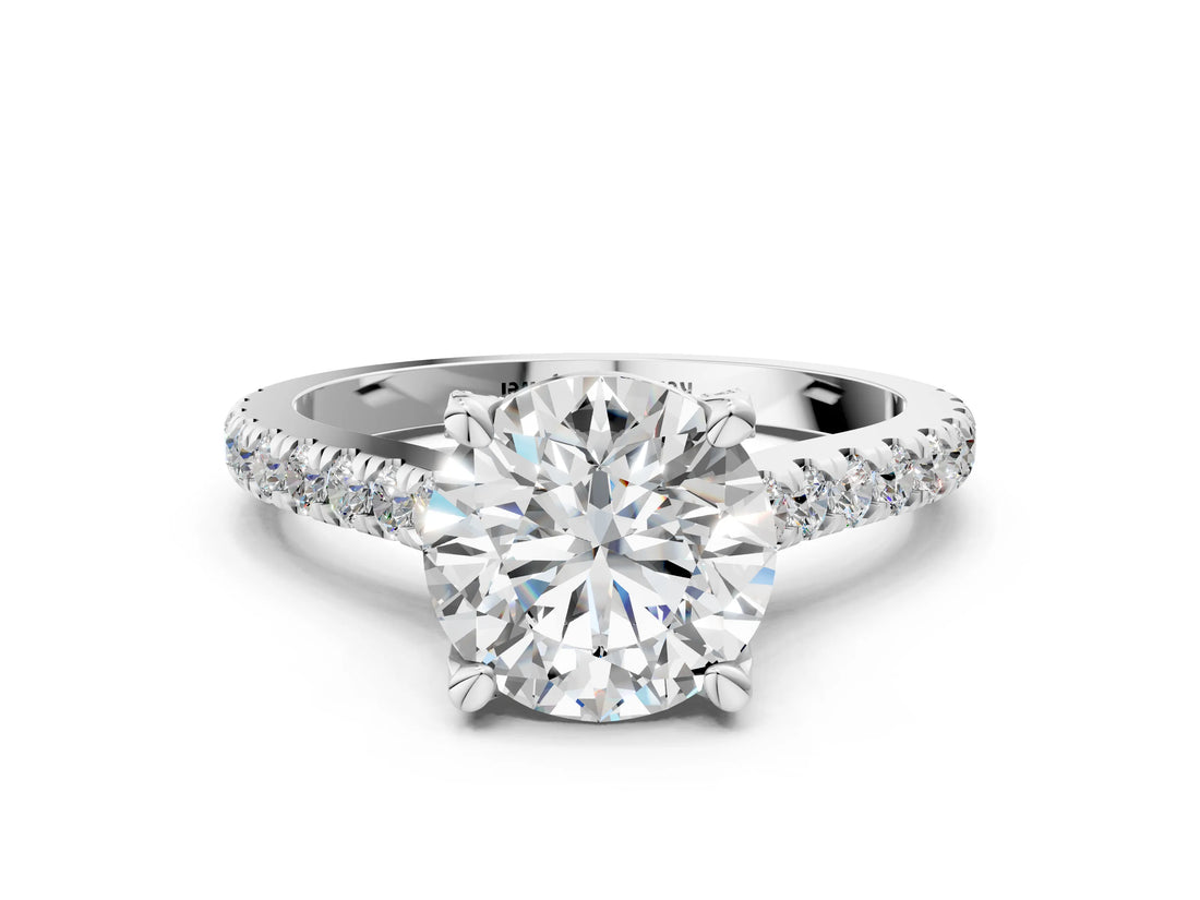 Platinum Round Brilliant Diamond Solitaire with Pavé Band and Four-Prong Setting
