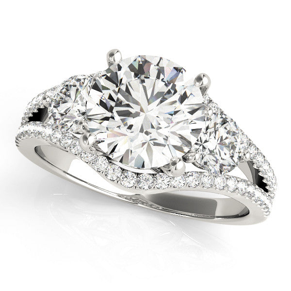 Platinum Round Brilliant Three-Stone Diamond Ring with Pavé Band and Prong Setting