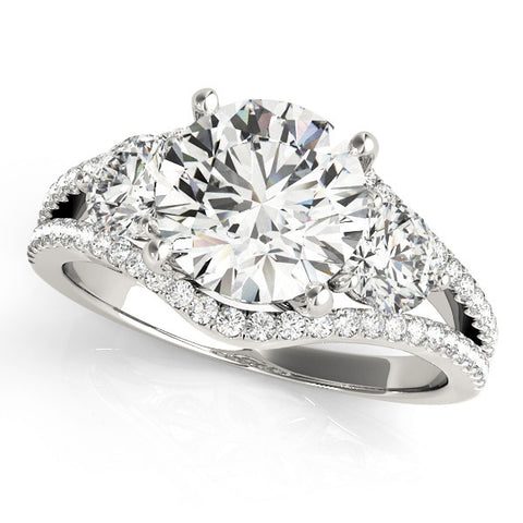 Platinum Round Brilliant Three-Stone Diamond Ring with Pavé Band and Prong Setting