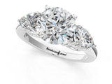 Platinum Round Brilliant Three-Stone Ring with Pear Side Stones and Four-Prong Setting_18