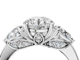 Platinum Round Brilliant Three-Stone Ring with Pear Side Stones and Four-Prong Setting_21