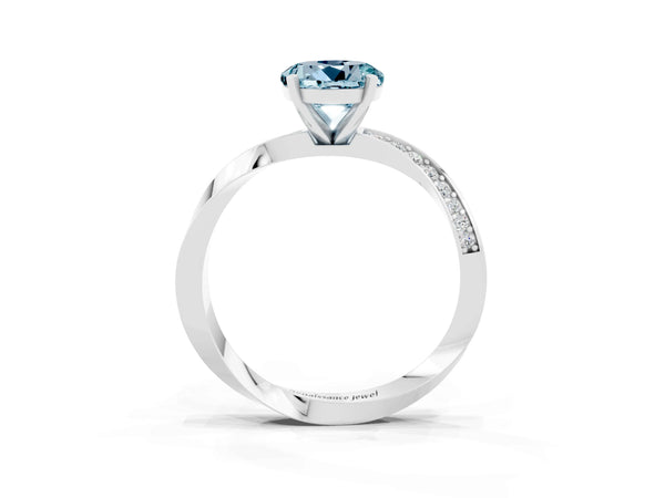 Platinum Round Cut Aquamarine Engagement Ring with Side Stone Accents and Four-Prong Setting