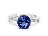 Platinum Round Cut Blue Sapphire Engagement Ring with Side Stone Accents and Four-Prong Setting_12