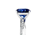 Platinum Round Cut Blue Sapphire Engagement Ring with Side Stone Accents and Four-Prong Setting_17
