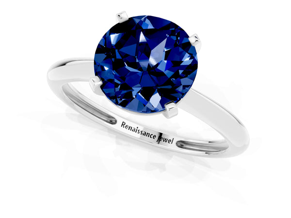 Platinum Round Cut Blue Sapphire Solitaire Engagement Ring with Classic Band and Four-Prong Setting