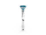 Platinum Round Cut Blue Topaz Engagement Ring with Side Stone Accents and Four-Prong Setting_26