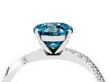 Platinum Round Cut Blue Topaz Engagement Ring with Side Stone Accents and Four-Prong Setting_28