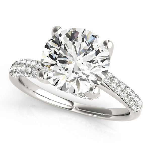 Platinum Round Cut Diamond Solitaire Engagement Ring with Pave Band and Four-Prong Setting