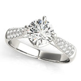 Platinum Round Cut Diamond Solitaire Ring with Pavé-Set Shoulders and Four-Prong Setting