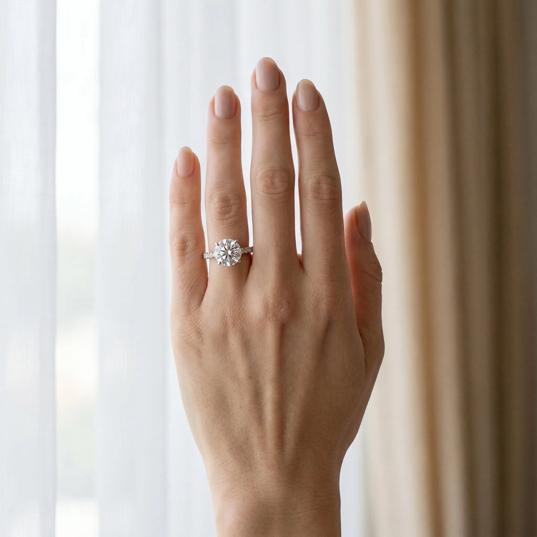Platinum Round Cut Diamond Solitaire Ring with Round  Pavé Band and Four-Prong Setting
