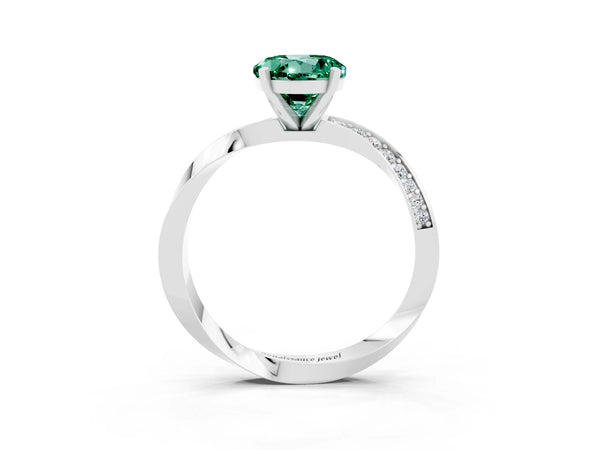 Platinum Round Cut Green Sapphire Engagement Ring with Side Stone Accents and Four-Prong Setting