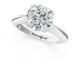 Platinum Round Cut Solitaire Engagement Ring with Tapered Band and Four-Prong Setting 1