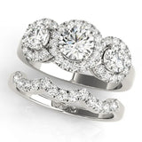 Platinum Round Diamond Three-Stone Halo Ring with Prong Setting and Pavé Accents 1