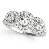 Platinum Round Diamond Three-Stone Halo Ring with Prong Setting and Pavé Band
