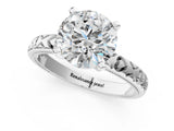 Platinum Round Solitaire Diamond Engagement Ring with XO Engraved Band and Four-Prong Setting 1