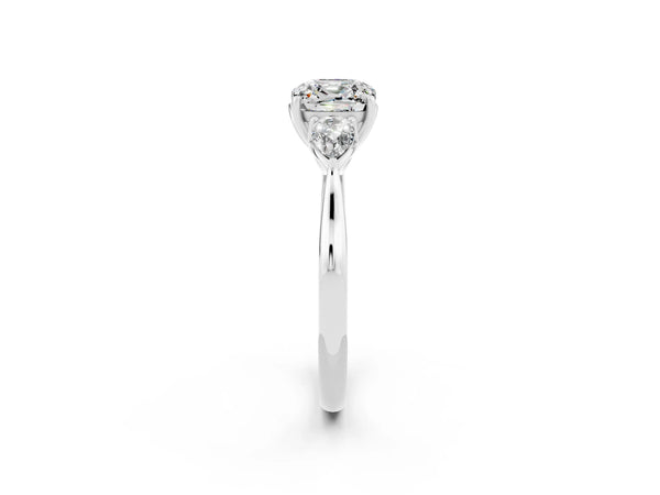 Platinum Three-Stone Cushion Cut Moissanite Ring with Pear  Side Stones in Four-Prong Setting