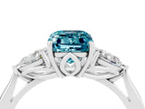 Platinum Three-Stone Emerald Cut Blue Topaz Ring with Pear  Side Stones in Four-Prong Setting_58