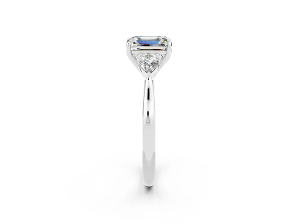 Platinum Three-Stone Emerald Cut Moissanite Ring with Pear  Side Stones in Four-Prong Setting