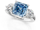 Platinum Three-Stone Fancy Blue Asscher  Brilliant Cut Solitaire Ring with Prong Setting on a Classic Band 2