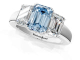 Platinum Three-Stone Fancy Blue Emerald Cut Cut Diamond Ring with Channel Set Band and Four-Prong Setting_19